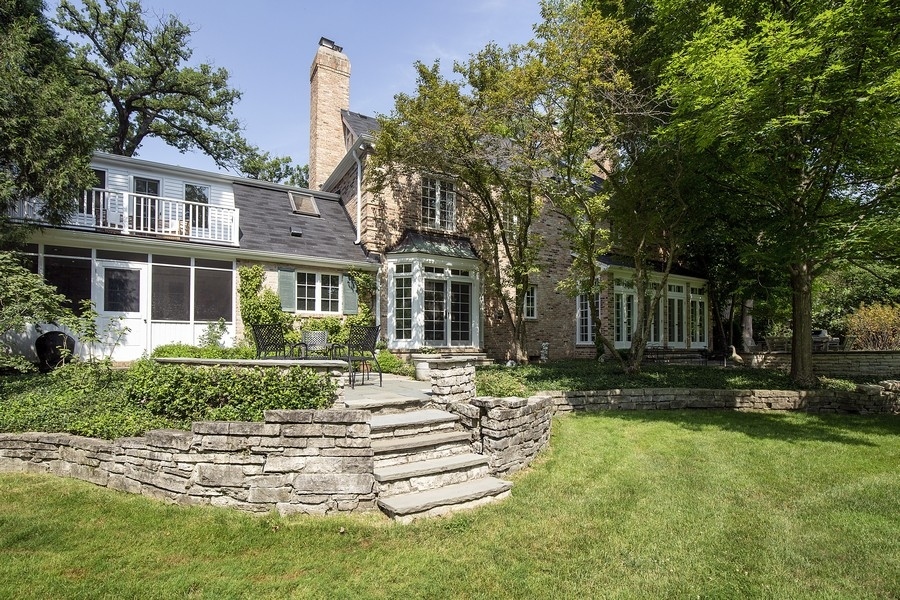 641 Briar Lane Northfield, IL 60093 - Photo 29 of 35 a front view of a house with a yard table and chairs
