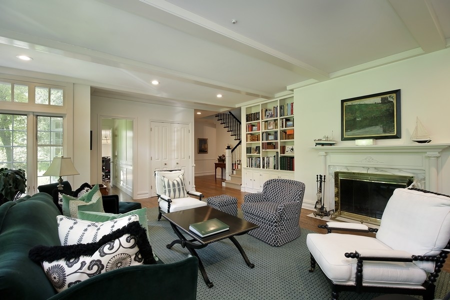 641 Briar Lane Northfield, IL 60093 - Photo 9 of 35 a living room with furniture fireplace and a flat screen tv