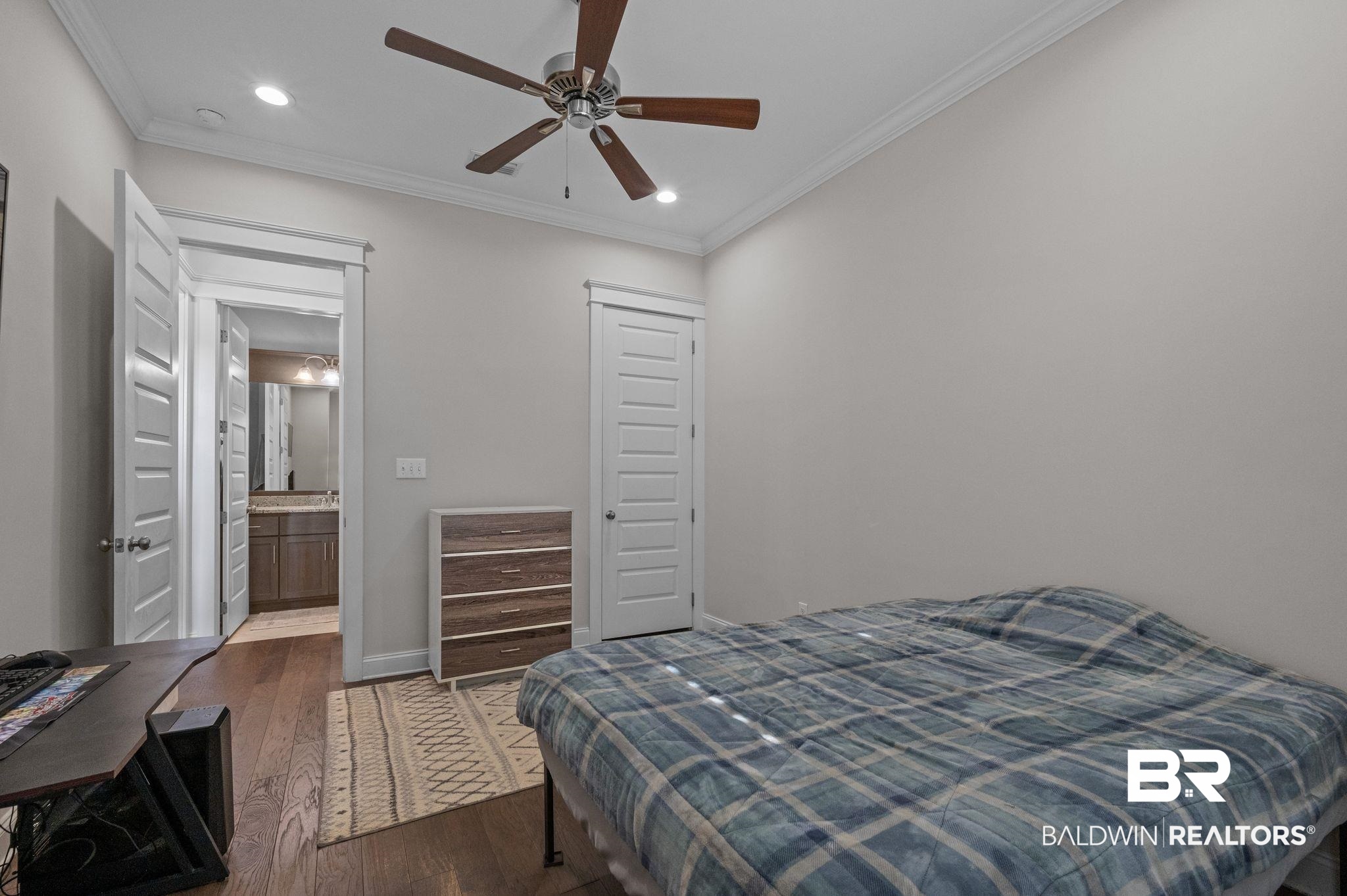 32194 Badger Court Daphne, AL 36527 - Photo 29 of 49 Bedroom with crown molding, dark wood finished floors, recessed lighting, a closet, and a ceiling fan