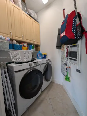 a kitchen with a sink stove and microwave