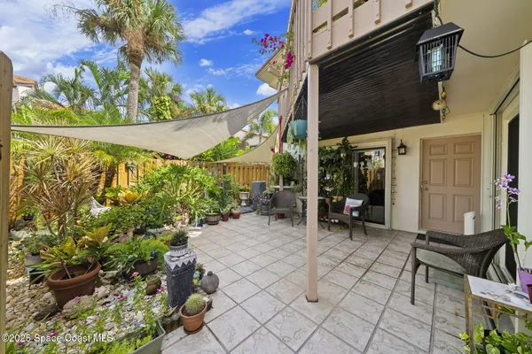 a view of a chairs and table in a patio