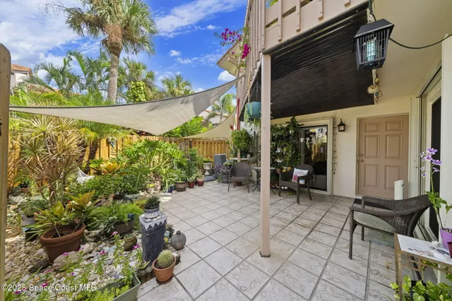 a view of a chairs and table in a patio