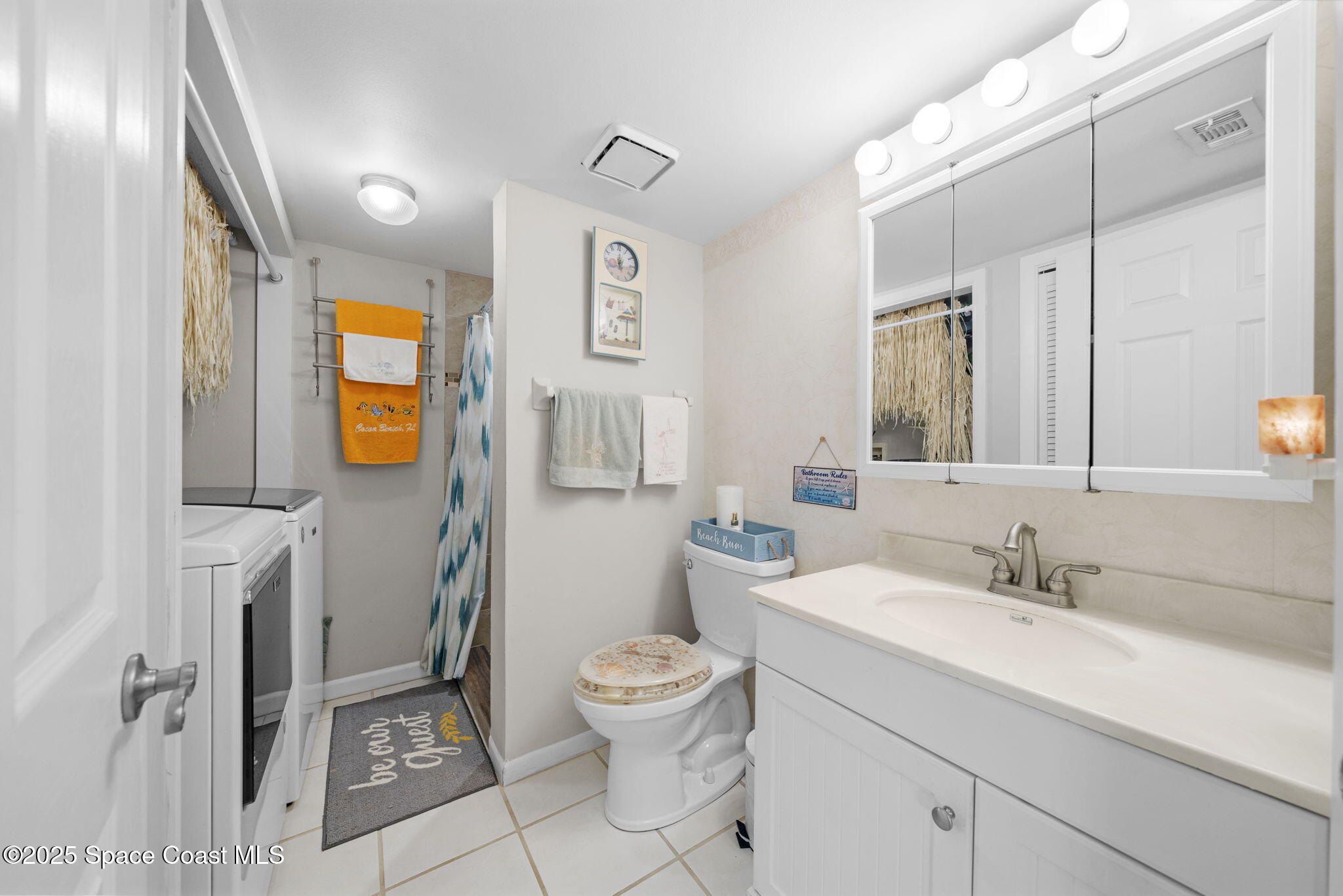 200 South Banana River Boulevard, Unit 803 Cocoa Beach, FL 32931 - Photo 17 of 46 Downstairs bath & laundry