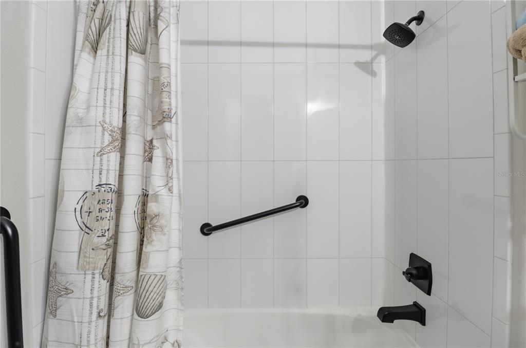 9689 East White Egret Path Inverness, FL 34450 - Photo 25 of 44 a bathroom with a shower