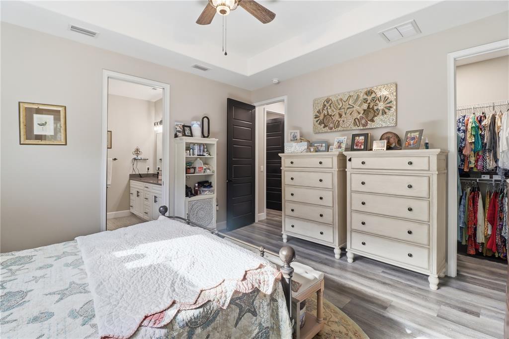 9689 East White Egret Path Inverness, FL 34450 - Photo 29 of 44 a bedroom with a bed and closet