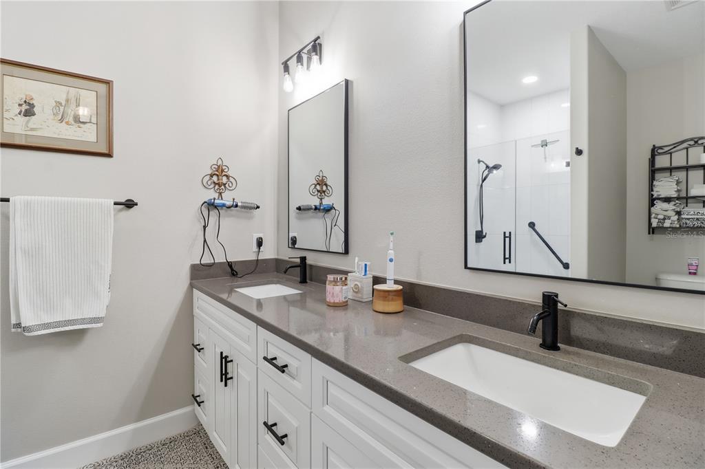 9689 East White Egret Path Inverness, FL 34450 - Photo 30 of 44 a bathroom with a sink and a mirror