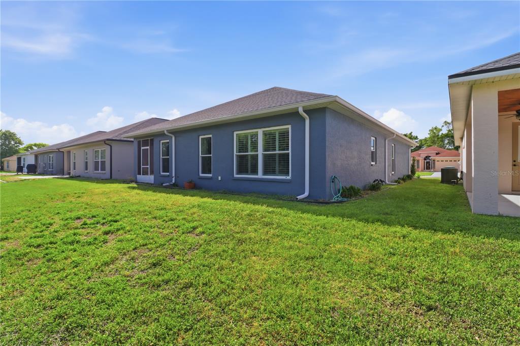 9689 East White Egret Path Inverness, FL 34450 - Photo 39 of 44 a view of a house with a backyard