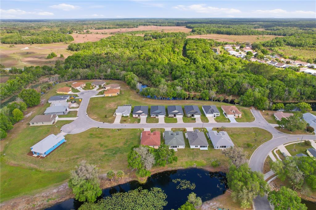 9689 East White Egret Path Inverness, FL 34450 - Photo 43 of 44 an aerial view of a house with outdoor space swimming pool and mountains