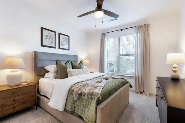 a bedroom with bed and window