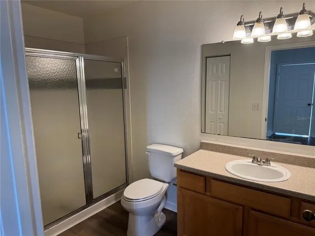 a bathroom with a sink toilet and vanity