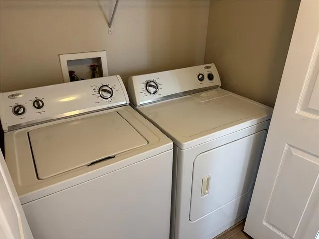 a utility room with dryer and washer