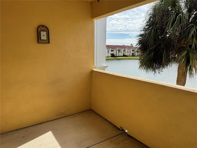 an empty room with a large window and outer view