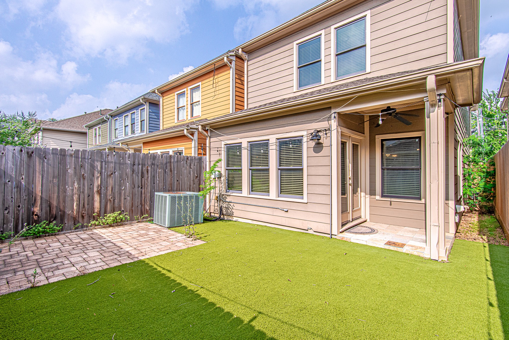 1425 Prince Street Houston, TX 77008 - Photo 22 of 22 Backyard view featuring fenced yard and covered patio for outdoor enjoyment.