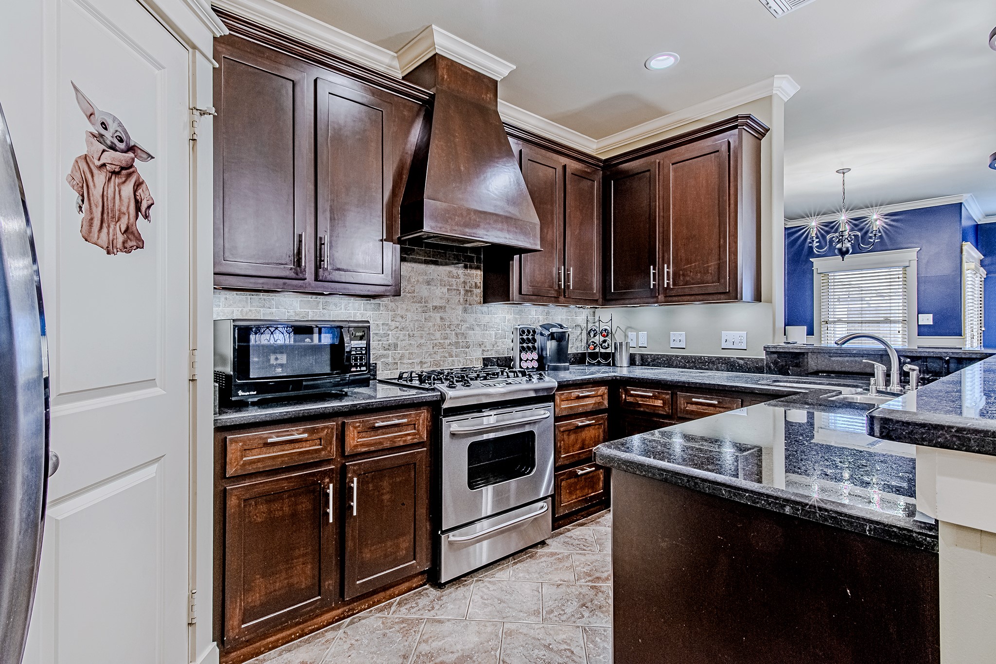 1425 Prince Street Houston, TX 77008 - Photo 10 of 22 Well-appointed kitchen with rich wood cabinetry, granite countertops, and ample prep space.