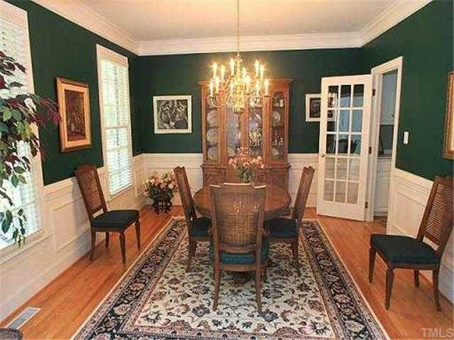 13917 Possum Track Road Raleigh, NC 27614 - Photo 4 of 12 a view of a dining room with furniture window and wooden floor