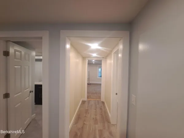 a view of room with window and a ceiling fan