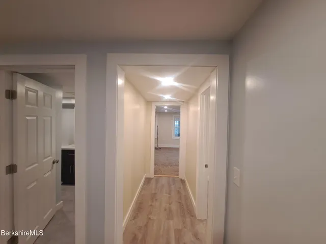 a view of room with window and a ceiling fan