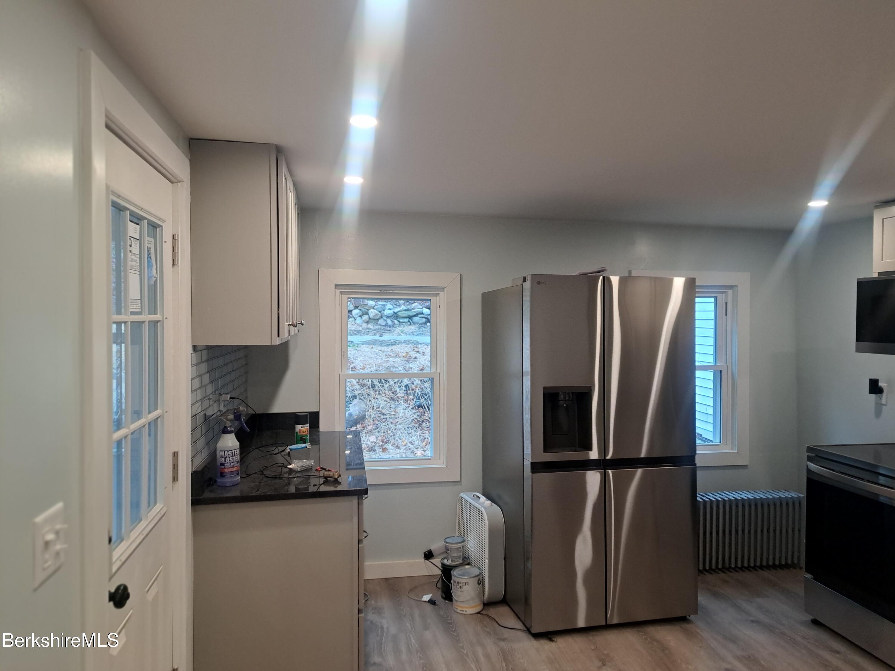 84 West Main Street North Adams, MA 01247 - Photo 6 of 15 a kitchen with a refrigerator and a stove top oven