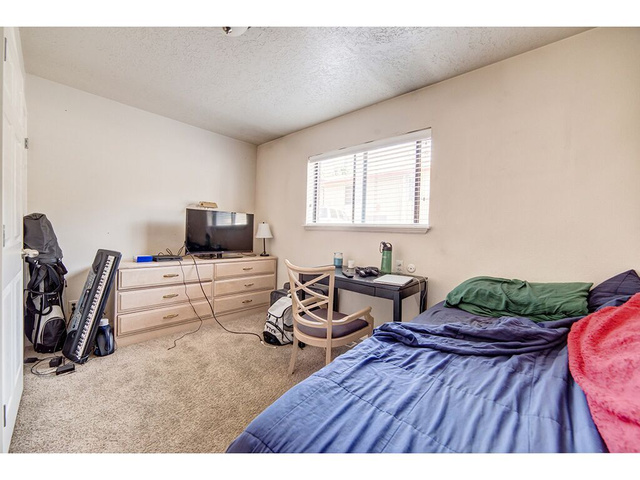 865 North 500 West, Unit 5 Provo, UT 84604 - Photo 4 of 14 Interior room featuring a single window with blinds, neutral wall paint, and carpet flooring