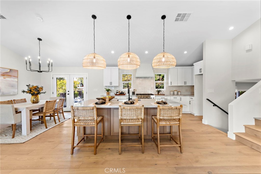1850 Oriole Drive Costa Mesa, CA 92626 - Photo 11 of 33 a view of a dining room and hall with kitchen view