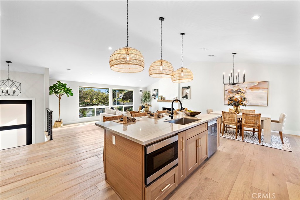 1850 Oriole Drive Costa Mesa, CA 92626 - Photo 13 of 33 a view of a kitchen with stove and wooden floor