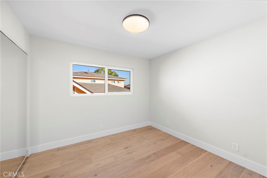 1850 Oriole Drive Costa Mesa, CA 92626 - Photo 28 of 33 a view of a room with wooden floor and window