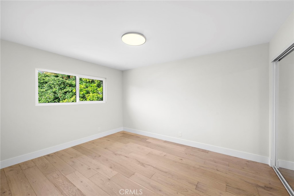 1850 Oriole Drive Costa Mesa, CA 92626 - Photo 30 of 33 an empty room with a window