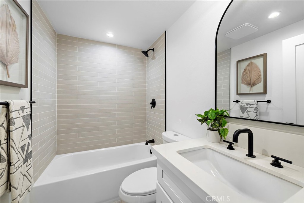 1850 Oriole Drive Costa Mesa, CA 92626 - Photo 32 of 33 a bathroom with a granite countertop sink mirror toilet and bathtub