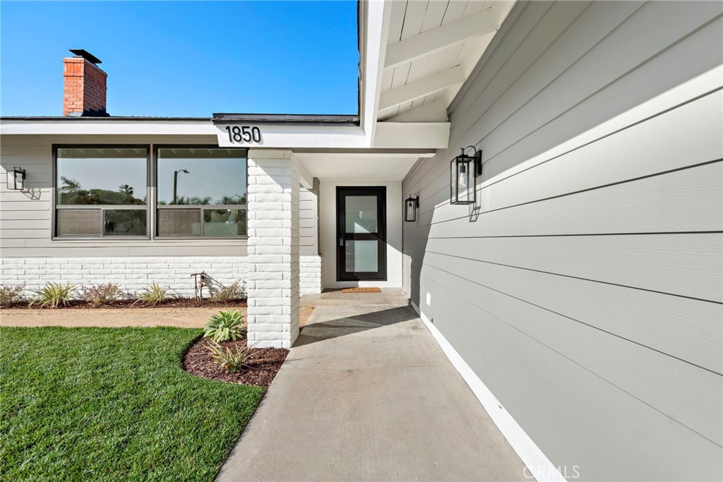 1850 Oriole Drive Costa Mesa, CA 92626 - Photo 4 of 33 a front view of a house with garden