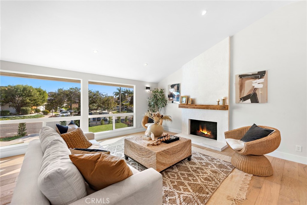 1850 Oriole Drive Costa Mesa, CA 92626 - Photo 7 of 33 a living room with furniture and a fireplace