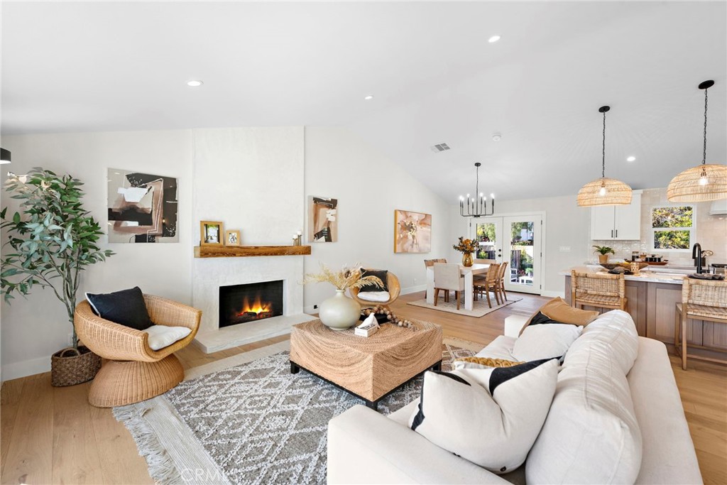 1850 Oriole Drive Costa Mesa, CA 92626 - Photo 8 of 33 a living room with furniture and a fireplace