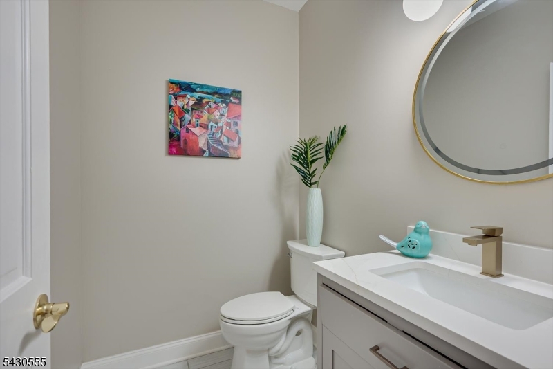 270 Mountain Road Bernards, NJ 07920 - Photo 19 of 41 a bathroom with a toilet a sink and mirror