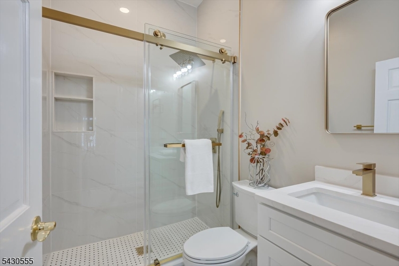 270 Mountain Road Bernards, NJ 07920 - Photo 22 of 41 a bathroom with a sink a toilet and shower