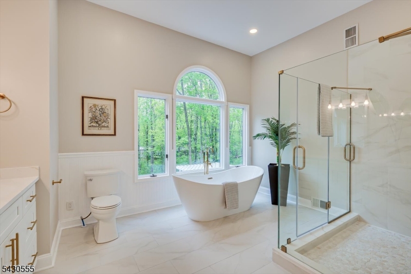 270 Mountain Road Bernards, NJ 07920 - Photo 29 of 41 a bathroom with a bathtub sink mirror and toilet