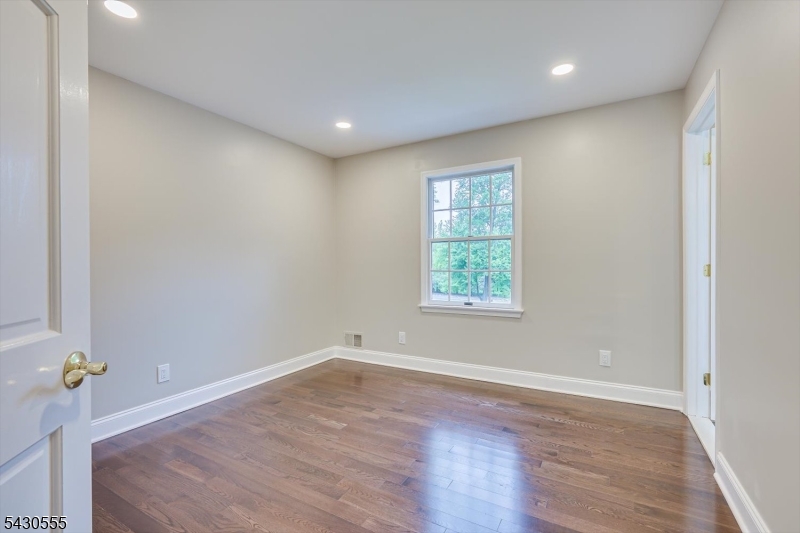 270 Mountain Road Bernards, NJ 07920 - Photo 32 of 41 an empty room with wooden floor and window