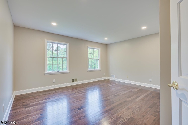 270 Mountain Road Bernards, NJ 07920 - Photo 34 of 41 an empty room with wooden floor and windows