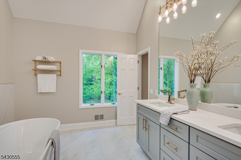 270 Mountain Road Bernards, NJ 07920 - Photo 35 of 41 a bathroom with a granite countertop sink and a bathtub