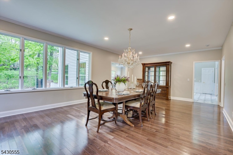 270 Mountain Road Bernards, NJ 07920 - Photo 8 of 41 a view of a dining room with furniture a chandelier and wooden floor