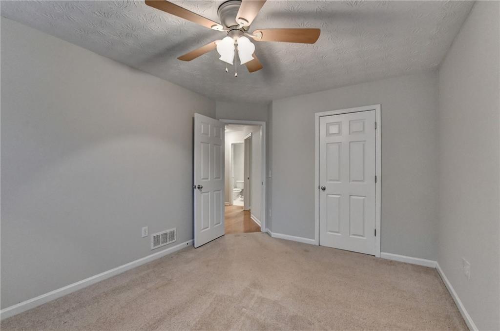 310 Andrew Ridge Drive Jefferson, GA 30549 - Photo 42 of 52 a view of an empty room and chandelier fan