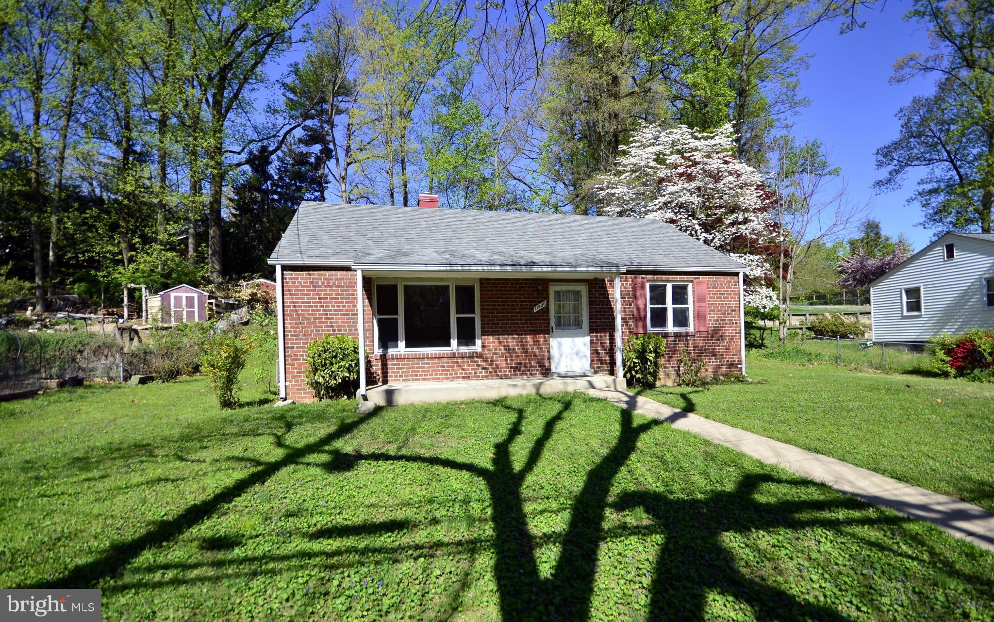11620 Gail Street Silver Spring, MD 20902 - Photo 2 of 21 a view of a house with backyard sitting area and garden