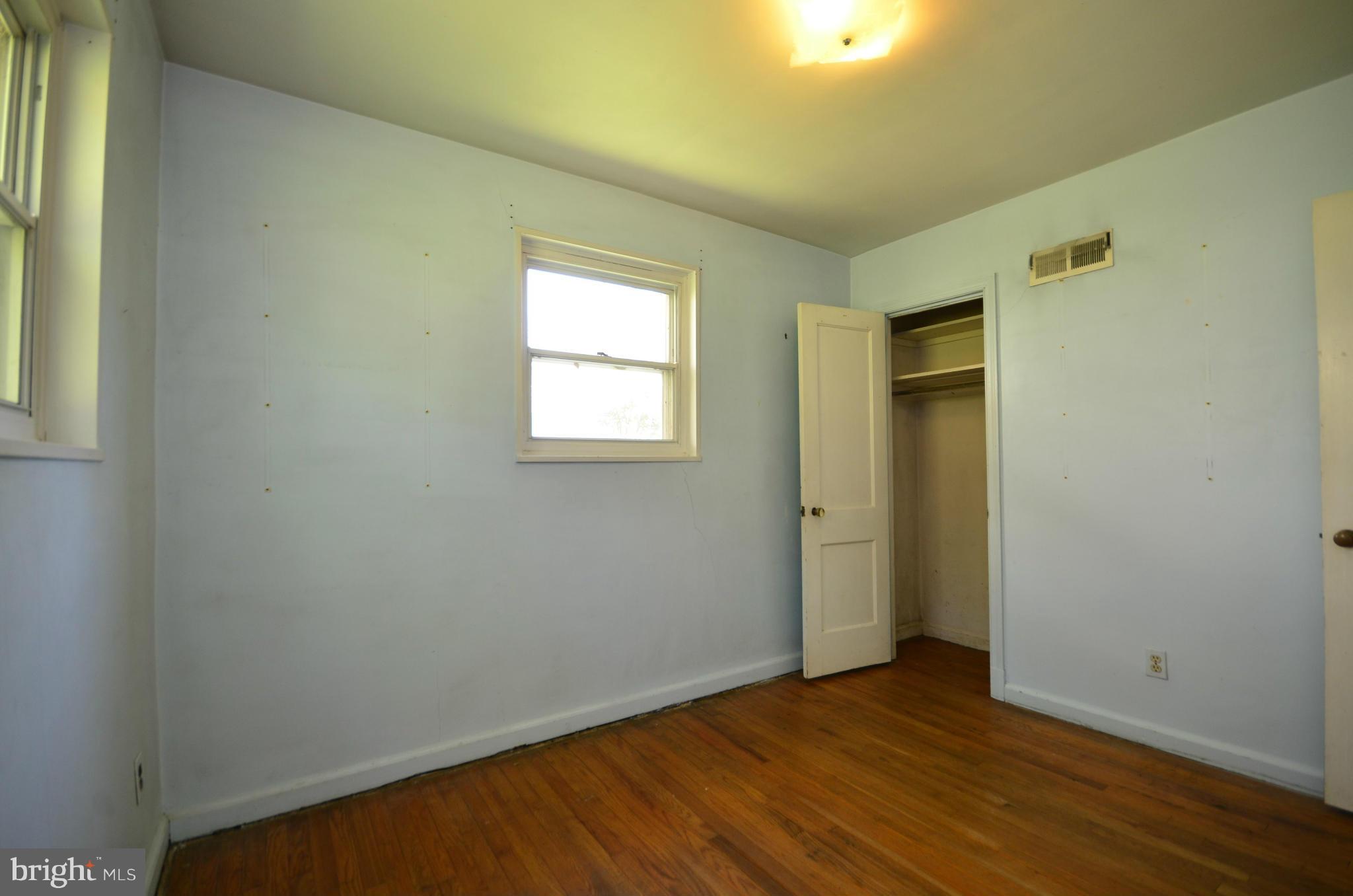 11620 Gail Street Silver Spring, MD 20902 - Photo 14 of 21 an empty room with wooden floor and windows