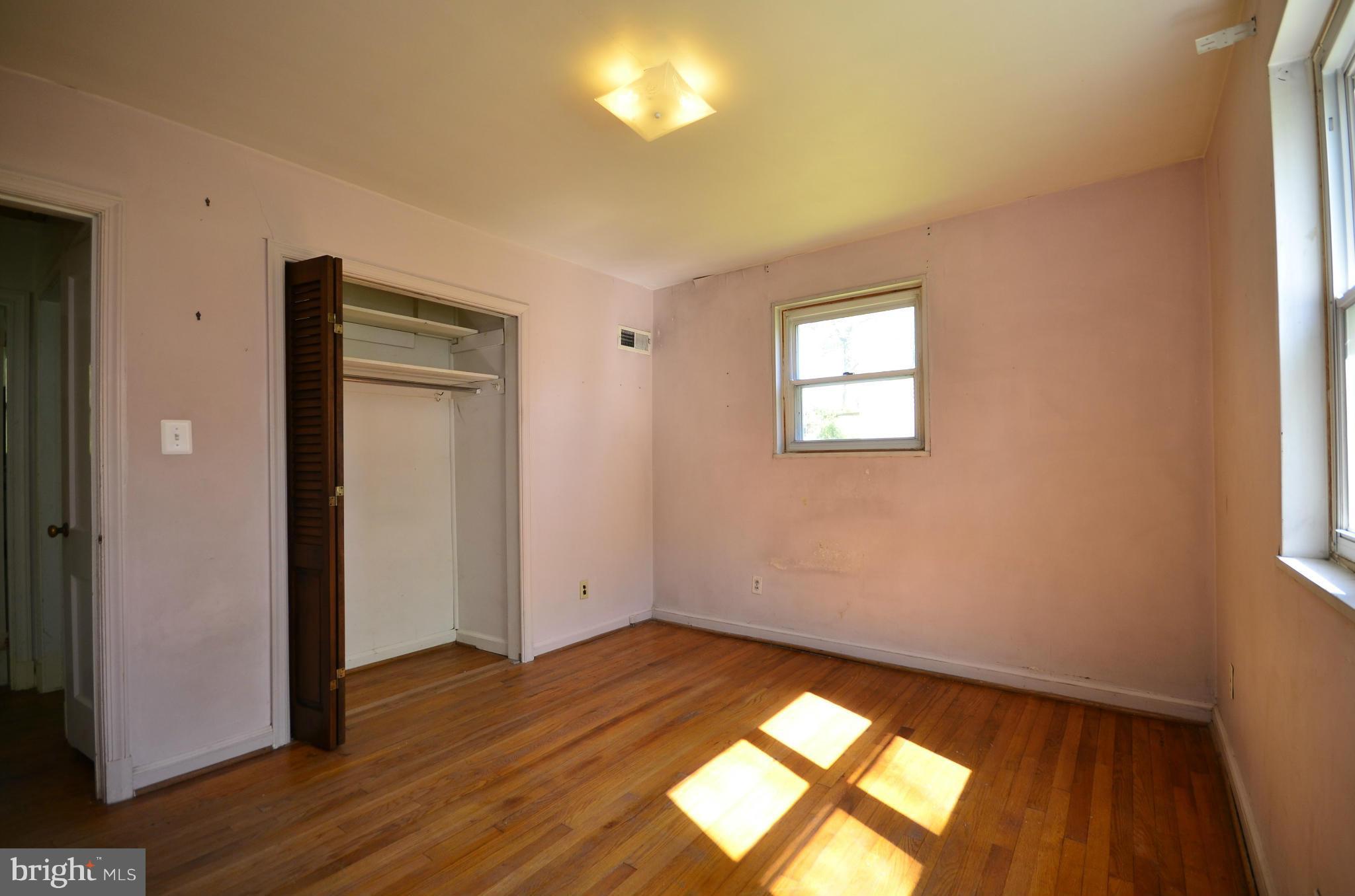 11620 Gail Street Silver Spring, MD 20902 - Photo 16 of 21 an empty room with wooden floor and windows