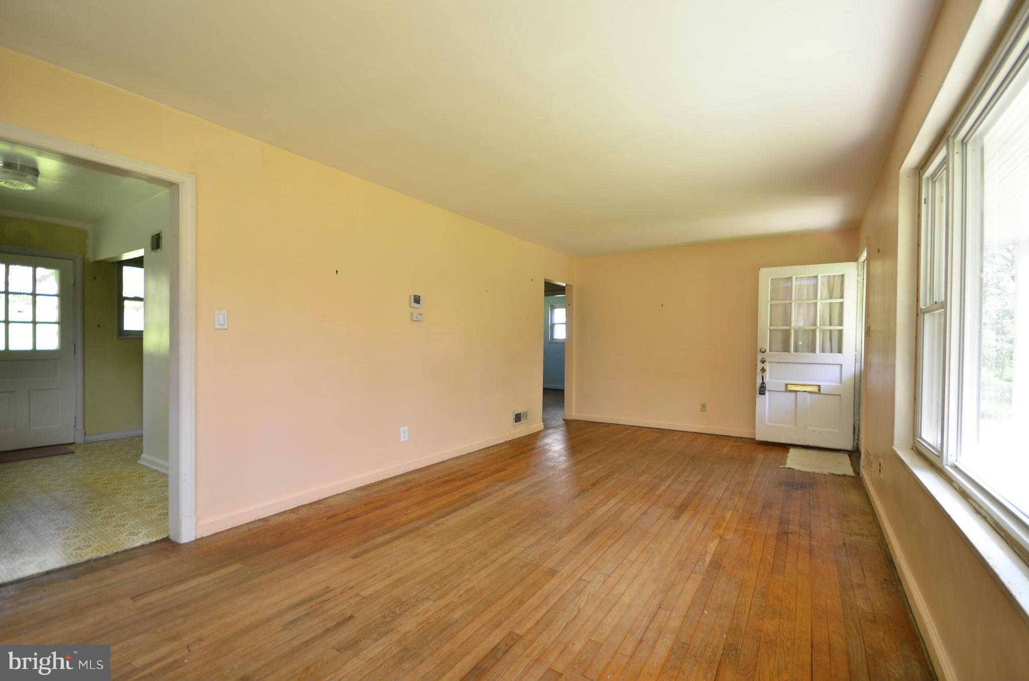 11620 Gail Street Silver Spring, MD 20902 - Photo 6 of 21 an empty room with wooden floor and windows