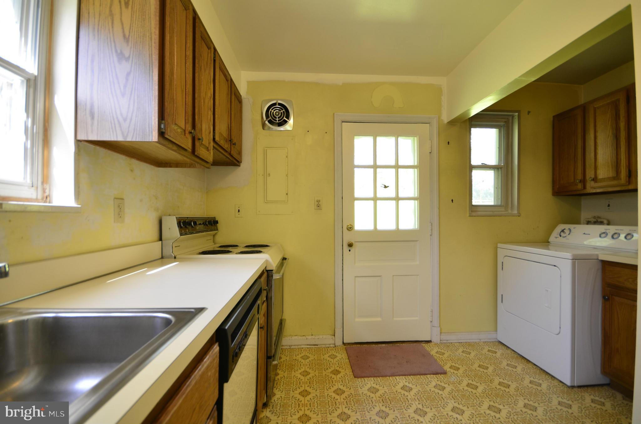 11620 Gail Street Silver Spring, MD 20902 - Photo 8 of 21 a kitchen with a sink and a stove top oven