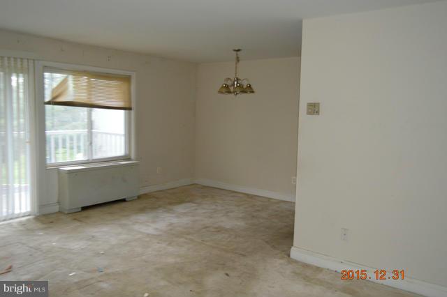 1009 Chillum Road, Unit 202 Hyattsville, MD 20782 - Photo 2 of 6 an empty room with windows