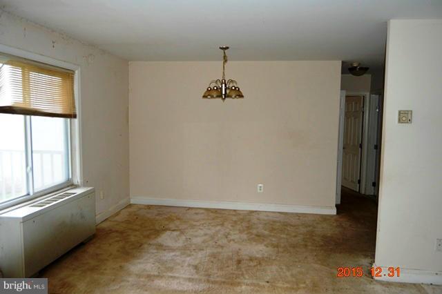 1009 Chillum Road, Unit 202 Hyattsville, MD 20782 - Photo 4 of 6 an empty room with windows