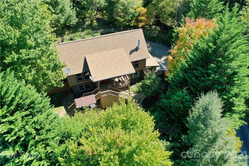 243 Rivermont Drive Canton, NC 28716 - Photo 2 of 29 an aerial view of a house with yard and trees all around