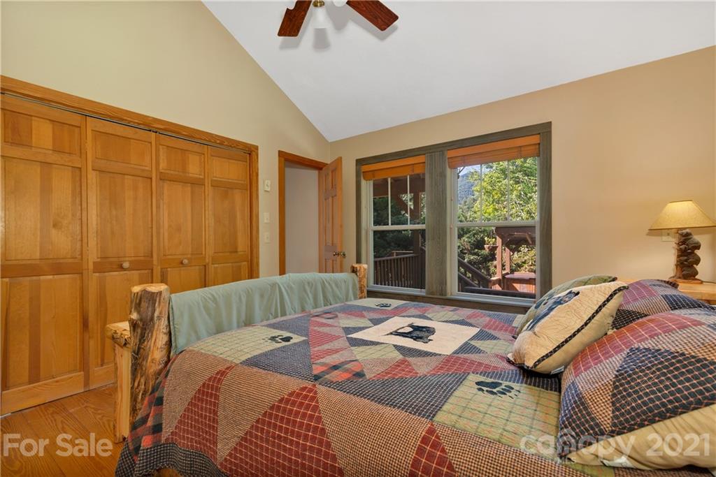 243 Rivermont Drive Canton, NC 28716 - Photo 14 of 29 a bedroom with a bed and a window