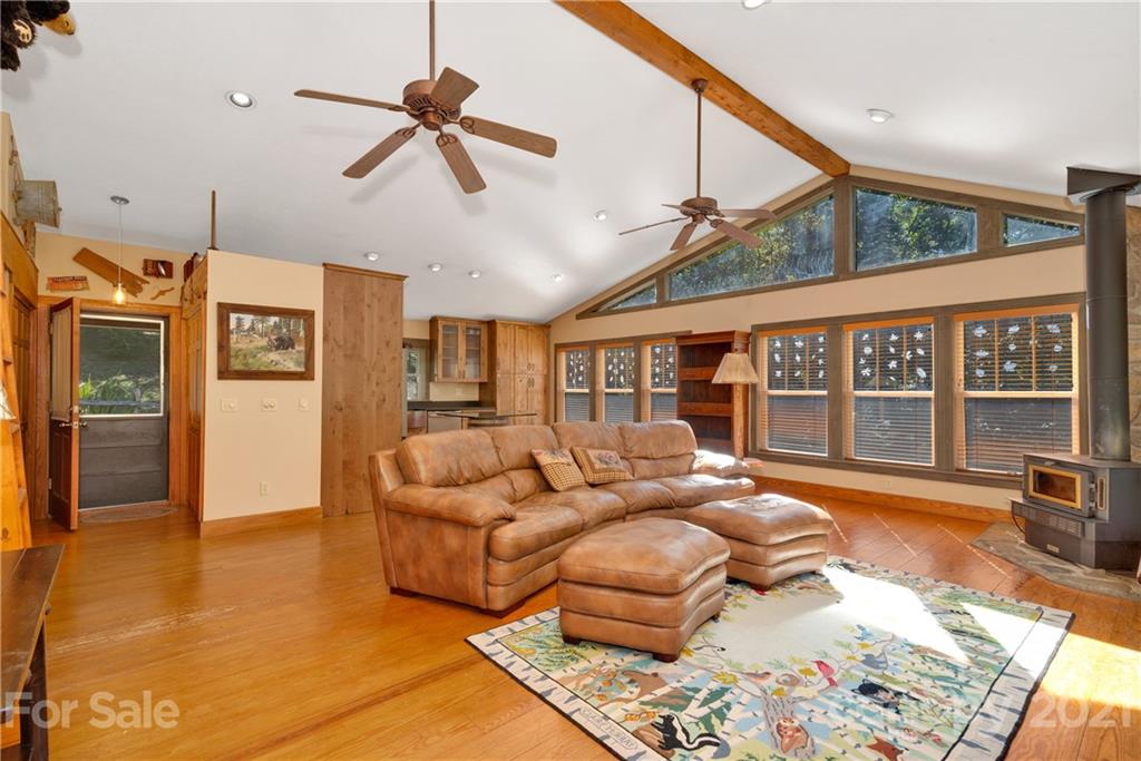 243 Rivermont Drive Canton, NC 28716 - Photo 3 of 29 a living room with furniture ceiling fan and a rug