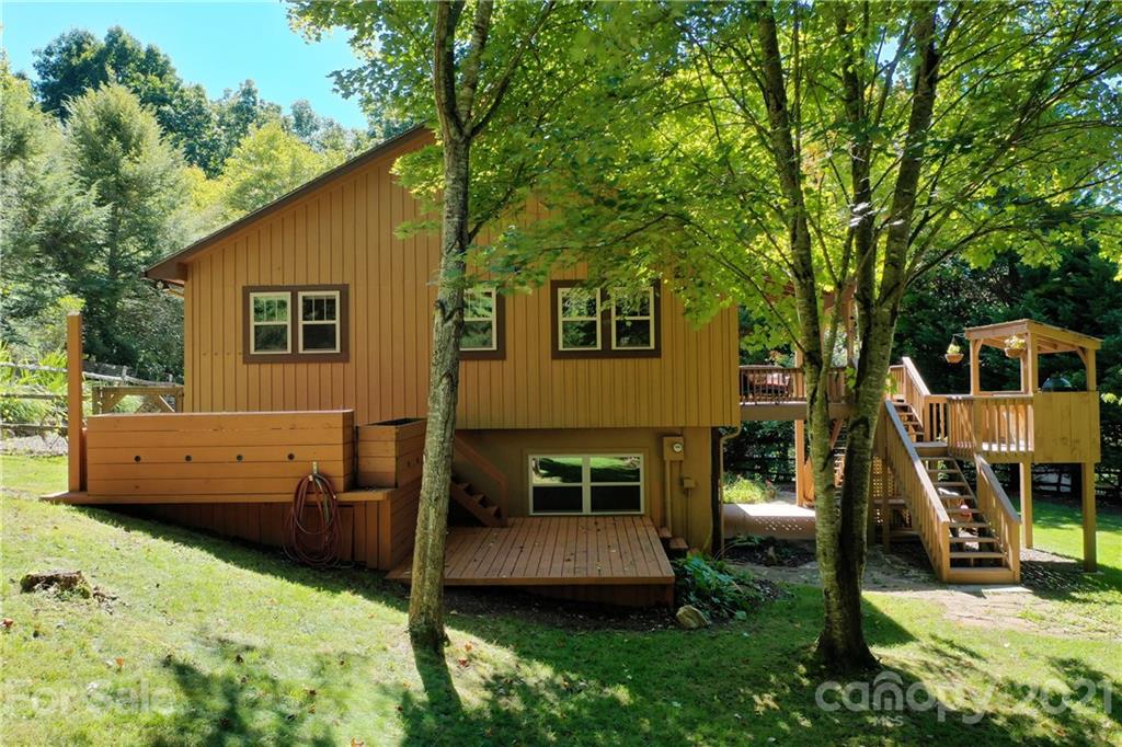 243 Rivermont Drive Canton, NC 28716 - Photo 27 of 29 a view of a house with backyard and a tree